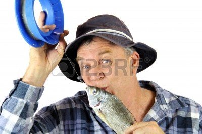 5274918-middle-aged-fisherman-kisses-the-fish-he-has-just-caught.jpg