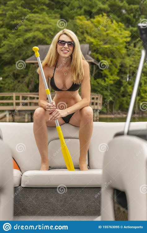 beautiful-bikini-model-relaxing-boat-doc