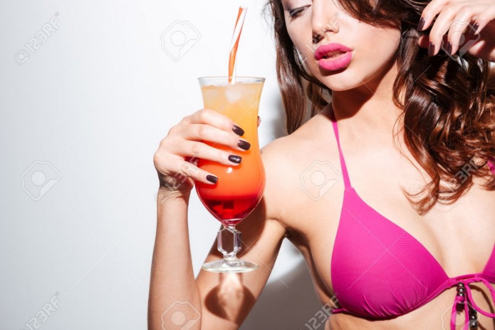 58083419-beautiful-sexy-girl-holding-cocktail-wearing-bikini-isolated-on-the-white-background.jpg